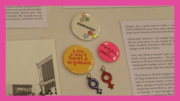 Grit and Diamonds exhibition, pins on a board saying 'you can't beat a woman', 'womenzade', and 'the future is female'