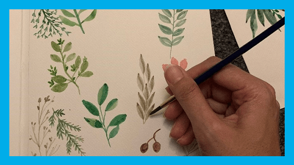 Mental health exhibition, hand painting plants on a piece of paper